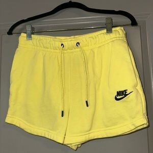 Nike yellow shorts, size extra small